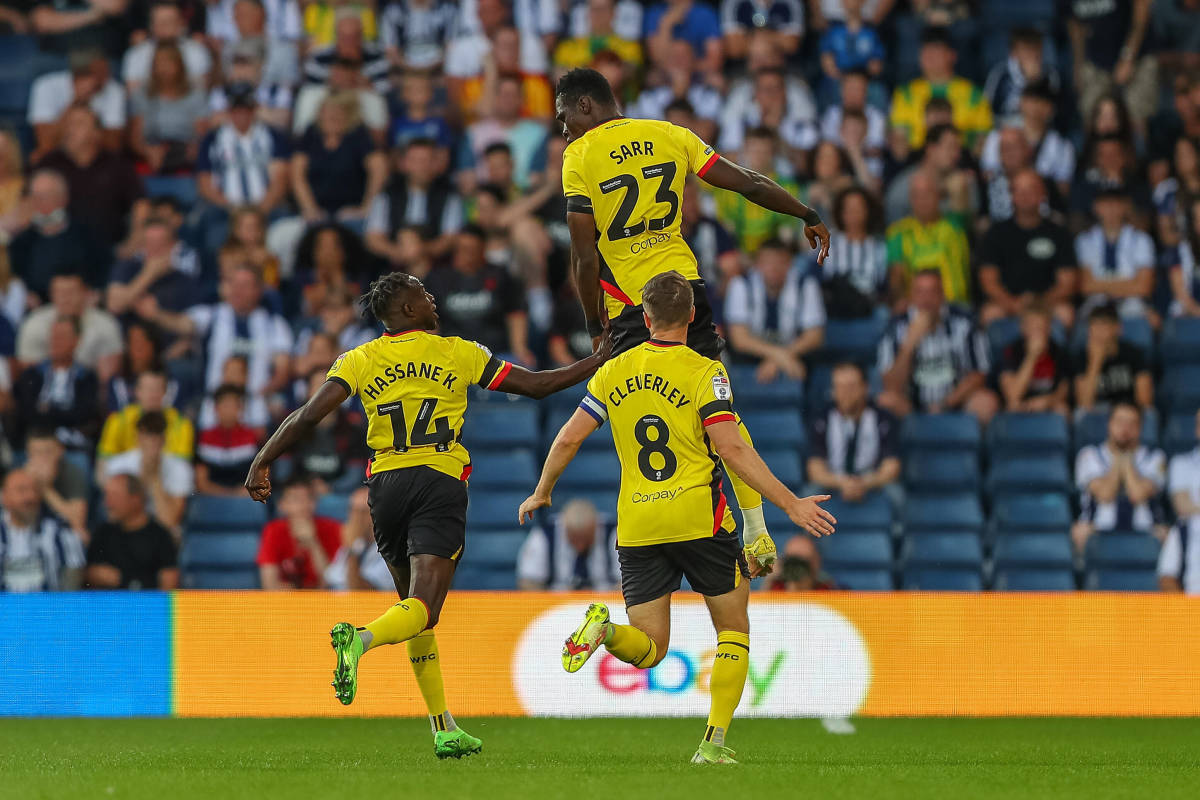 Ismaila Sarr pictured celebrating after scoring a goal from inside his own half for Watford against West Brom in August 2022